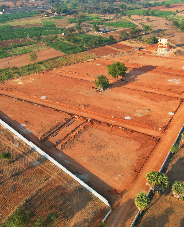 Luxury villa plots for sale in Hyderabad near Srisailam Highway – Gated community plots with lush green parks and premium amenities